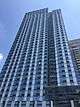 1 North 4th Place, a high-rise clad in blue glass, viewed from street level