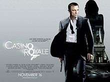 The poster shows Daniel Craig as James Bond, wearing a business suit with a loose tie and holding a gun. Behind him is a silhouette of a woman showing a building with a sign reading "Casino Royale" and a dark grey Aston Martin DBS below the building. At the bottom left of the image is the title "Casino Royale" – both "O"s stand above each other, and below them is a 7 with a trigger and gun barrel, forming Bond's codename: "Agent 007" – and the credits.