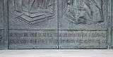 Inscription on the base of the front door, from Psalms 92:12-13: "The just man shall flourish like the palm tree, he shall grow like the cedar of Lebanon; they that are planted in the house of the Lord shall flourish in the courts of our God."