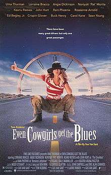 The poster features Uma Thurman squatting along a highway with her thumb out hitch-hiking