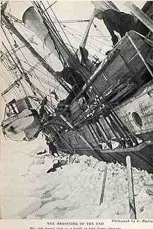 Side of a wooden steamship held in solid ice, leaning heavily to the left with a lfeboat swinging in its davits. One man visible on the ice, another aboard the ship, looking down.