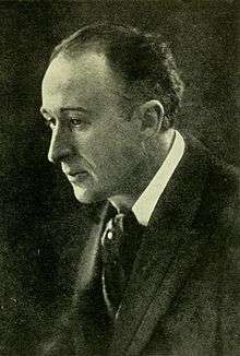 profile portrait of a slim middle-aged man, slightly balding, clean shaven