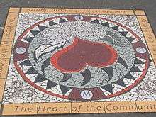 Mosaic sidewalk art on East Hastings Street, depicting a heart and the Community "The Heart of the City"