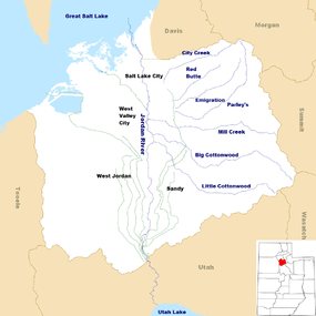 A map of Salt Lake County showing a river running from a lake in the south to a lake in the north. Canals branch off the river. Other creeks enter from the east. In the lower right corner is a map of Utah with a colored-in portion in the northern middle showing the location of Salt Lake County.