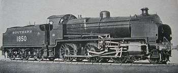 Official side view of a 2-6-0 locomotive against a white background. The distinguishing feature from normal N class locomotives is the experimental motion that powers the wheels.