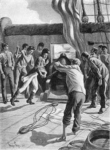 Several sailors are gathered around a cannon preparing it to fire a projectile