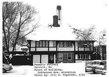 alt=A building with a sign reading Pewabic Pottery