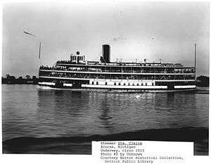 A large ferry, loaded with passengers