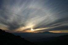 A picture of a solar halo shown as the fun sets