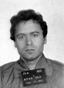 An unsmiling Bundy faces the camera.