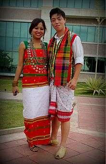 A man and a woman in traditional Tripuri dress