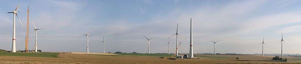 First wind farm consisting of 7.5 megawatt (MW) Enercon E-126 turbines, Estinnes, Belgium, 20 July 2010, two months before completion; note the 2-part blades.